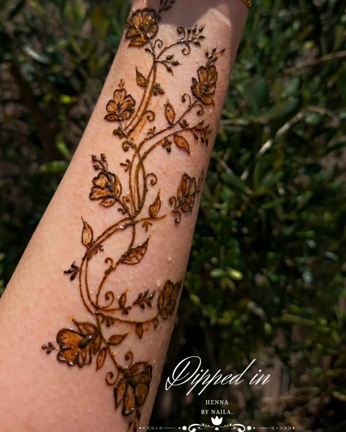 Trailing floral vines up the forearm