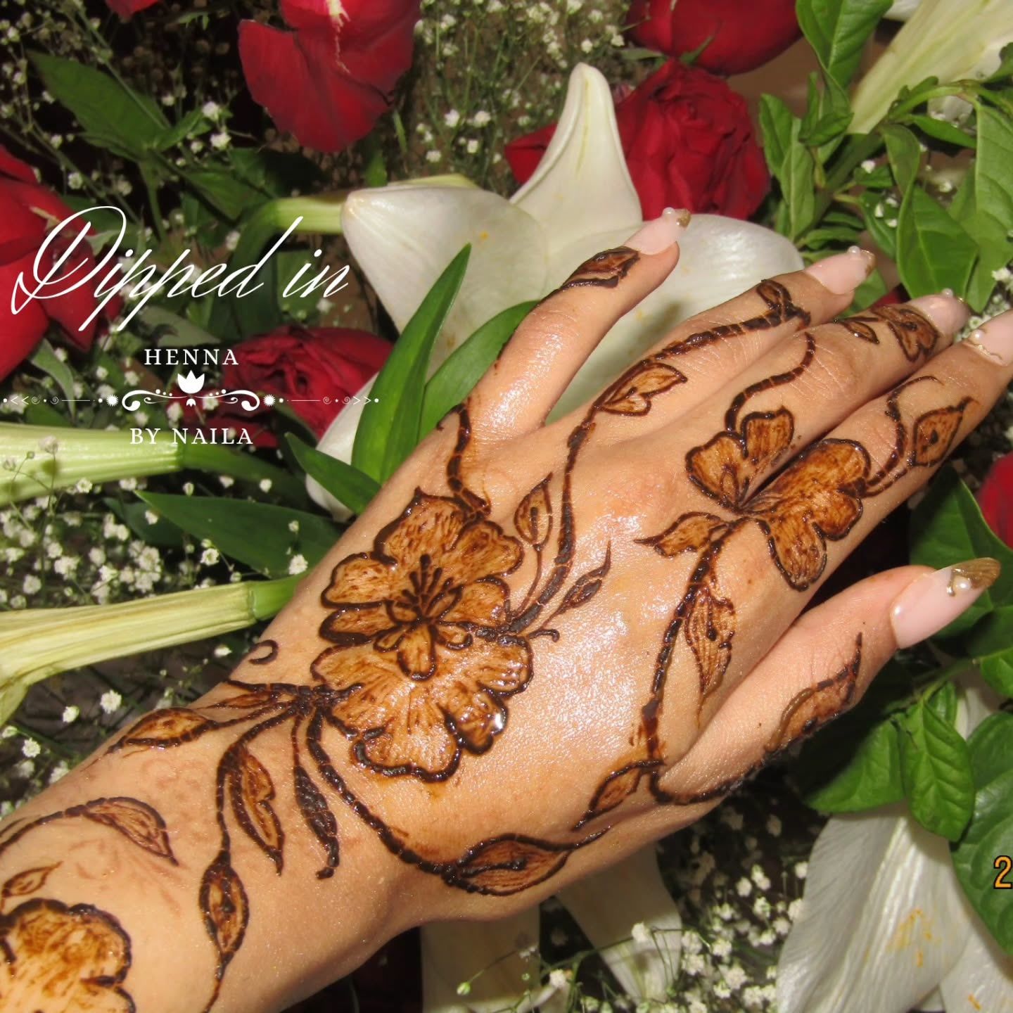 Floral vine henna among red roses